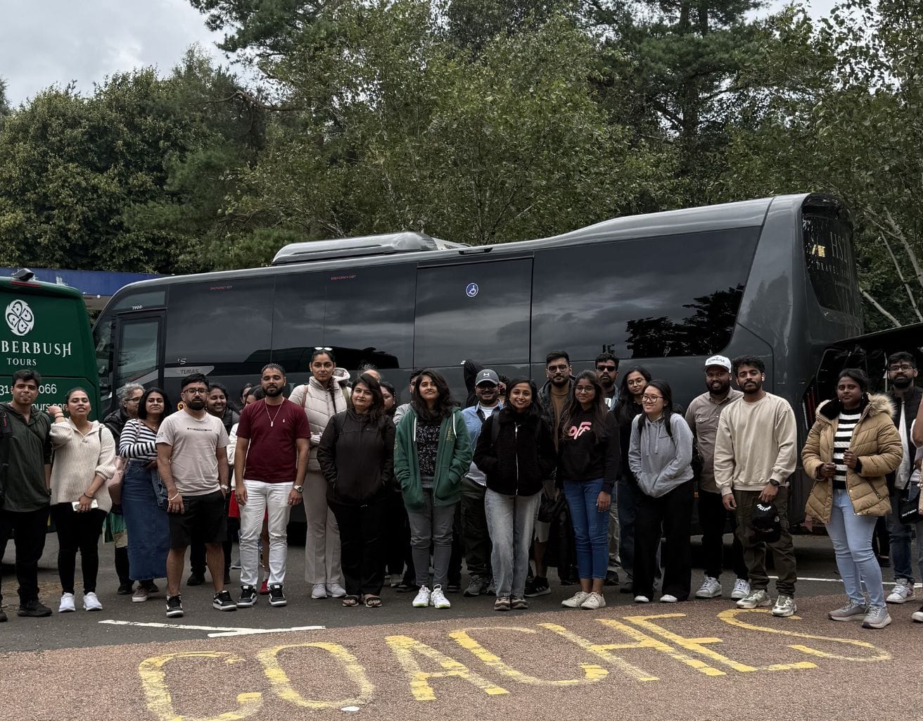 Travellers near the tour bus